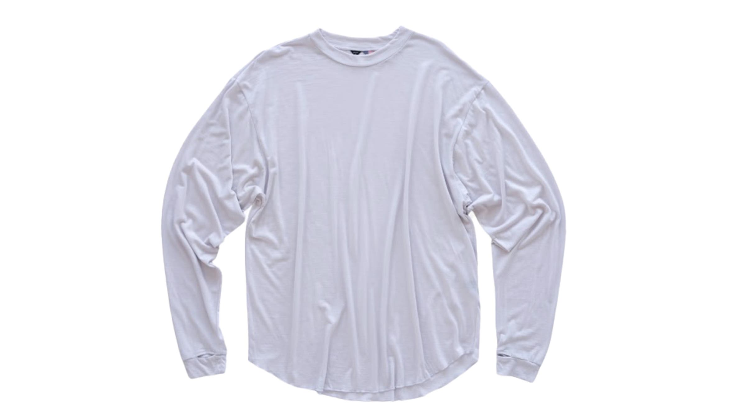 Light gray long-sleeve merino wool crewneck shirt laid flat against a white background. Delivers breathable, odor-resistant warmth as a base layer for any fastpack outing.